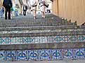 Steps with tiles with dark blue repeating patterns
