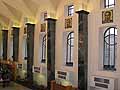 Wall of Corte Capitanale hall with tile panels above the windows