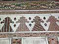 Wall with mosaic geometric inlay