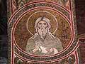 Mosaic of a saint, in the spandrel of an arch