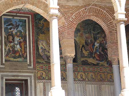 Arches with mosaics on wall behind