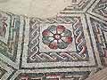 Guilloche and rose pattern in a geometric mosaic