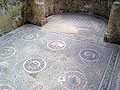 Mosaic floor featuring emblems various fruits